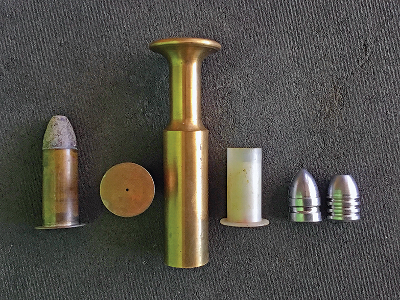 On the left is an original Maynard .50 caliber cartridge. Next is an original hull with a soldered-on rim and tiny flash hole in the center. In the middle is the original-style Maynard bullet seater. Next, is a white nylon case which is reusable and they only cost 68 cents apiece (I haven’t tried these yet.) Then comes a spitzer bullet that is very accurate, and on the far right is the bullet I used for this accuracy test.